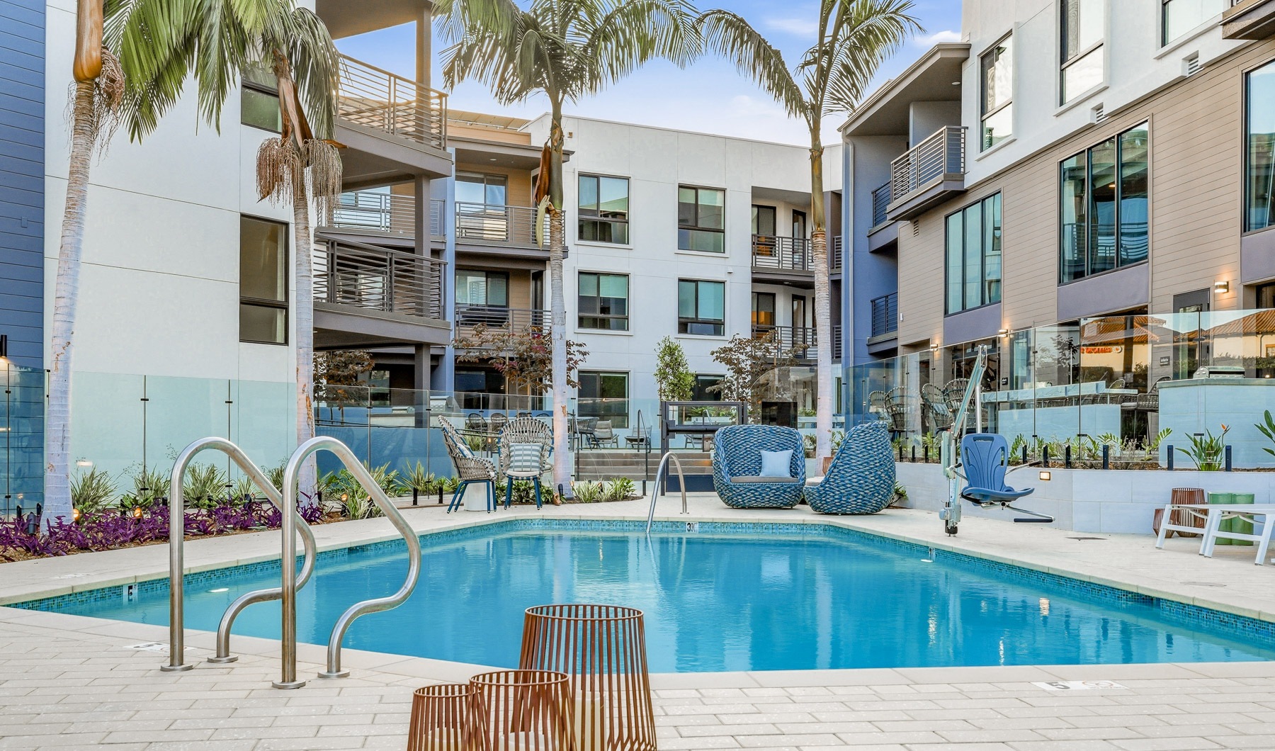 Resort-style swimming pool with lounge seating