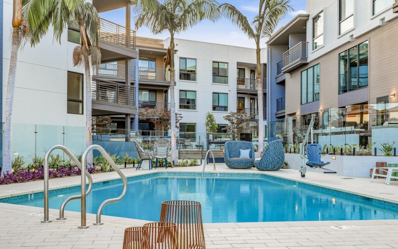Resort-style swimming pool with lounge seating